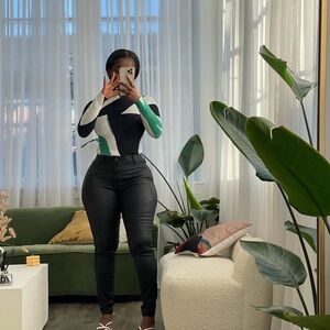 Stylish Black and White Sweater with Green Accents